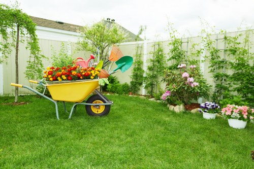 Gardening tools laid out on a Surbiton garden lawn